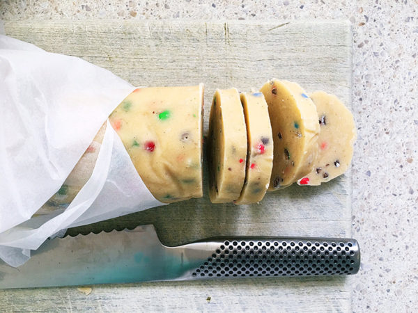 slicing cookie dough to bake