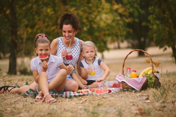 mum and kids having picnic