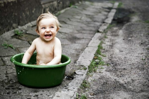 naked toddler in bucket