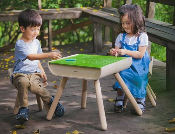 Chalk at the ready with this wooden table and chair set 