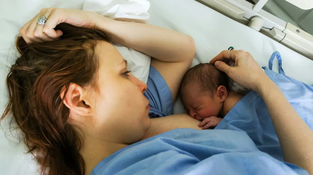 A Woman Breastfeeds Her Baby