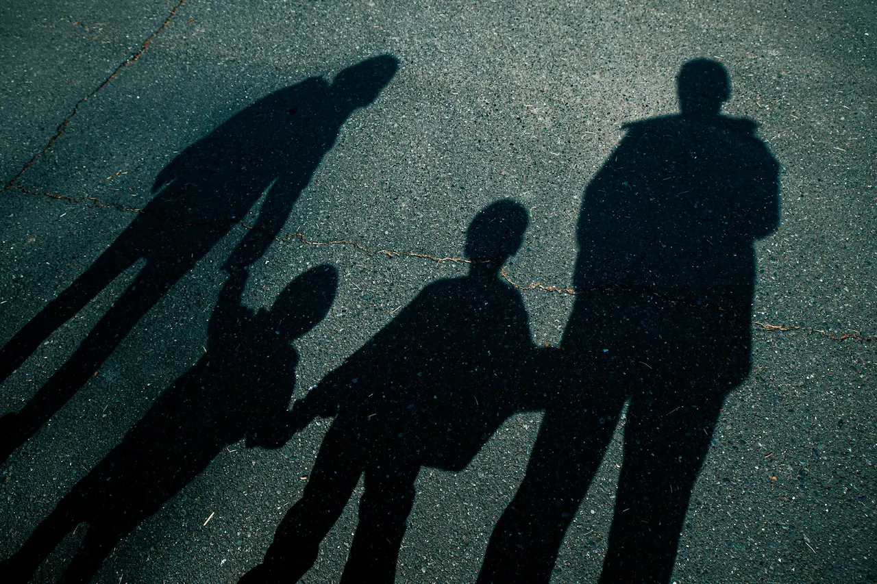 Shadow of a Family of Four on the Street