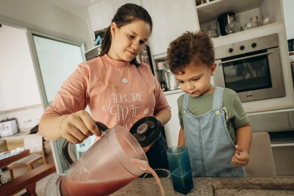 A Mom Pouring a Milk Shake for Her Little Boy