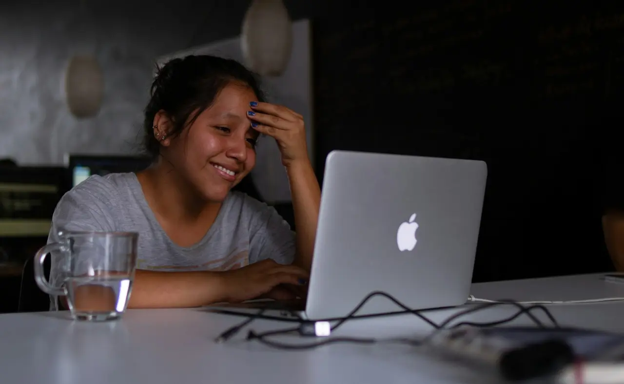 Stressed Mother Smiling While Working at Home