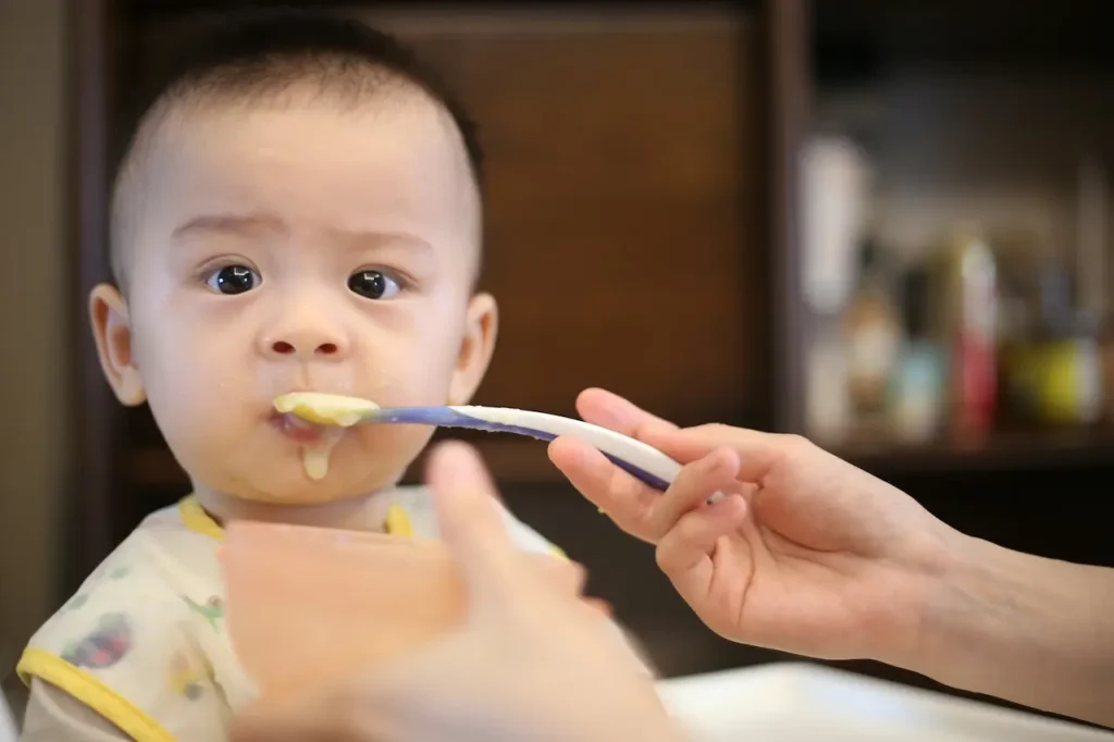 A Baby Boy is Fed by His Mother